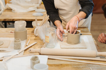 Fototapeta na wymiar Pottery Class: Female Friends Crafting Ceramic