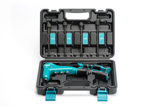 Aquamarine nut riveter set on white background.