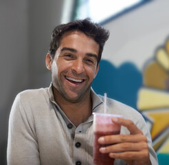 Portrait, drink and smoothie for man with smile for healthy diet of strawberry, fruit and show of...
