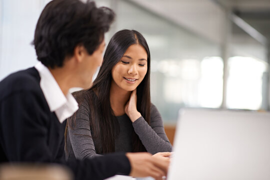 Business people, laptop and collaboration in office with Japanese staff and corporate team. Mentorship, tech and internet research for company project at a startup with consulting firm with planning