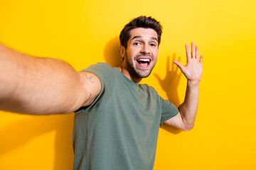 Portrait of good mood funny guy with bristle wear stylish t-shirt make selfie show highfive...