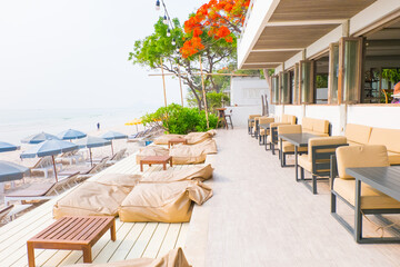 Rows of sun loungers and umbrellas on sandy beach in Tropical Beach,vacation concept.