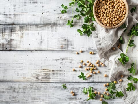 Bowls of soybeans and soybean pods on a wooden background