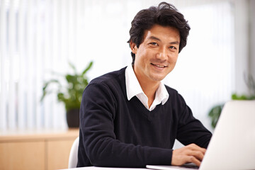 Portrait, laptop and professional asian business man in office for communication, chat or email. Corporate, entrepreneur and Japanese male employee with technology for internet, website and planning