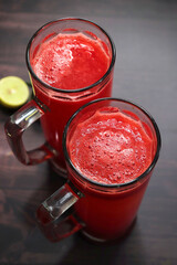 Fresh watermelon juice in a glass. Best summer drink to keep your body hydrated. It has a generous...