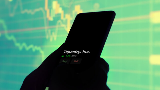 March 12th 2024 New York City, New York. The logo of Tapestry, Inc. on the screen of an exchange. Tapestry, Inc  price stocks, $TPR on a device.