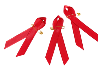 Red ribbons with golden pins for the Aids concept