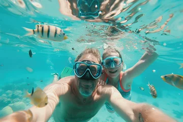 Fotobehang father, mother, child in snorkeling mask dive underwater with tropical fishes in coral reef sea pool © Kien