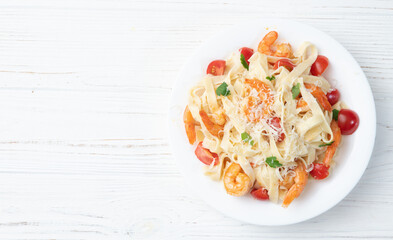Italian pasta with shrimps , parmesan and tomatoes