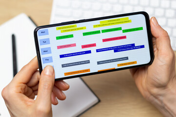 Schedule meetings and events on your phone screen. calendar for organizing events. Concept of planning dates, time management.
