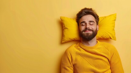 a young man sleeping on pillow isolated on pastel yellow colored background Sleep deeply peacefully...