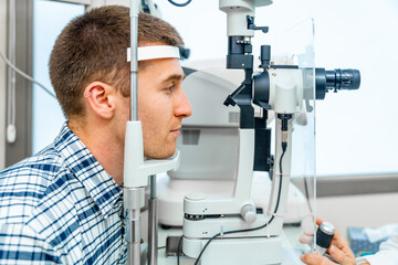 Men patient having a checkup, eye examined by specialist