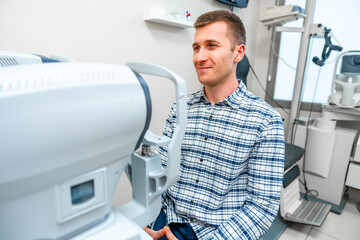 Man about to scan her eye in scanner machine