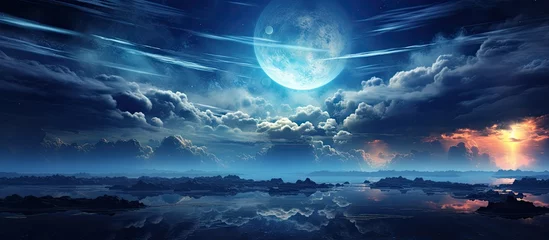 Tableaux ronds sur aluminium Bleu Jeans The full moon illuminates the sky, casting a silver light over the clouds hovering above a tranquil body of water, creating a magical natural landscape