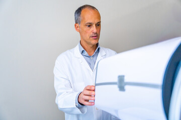 Ophthalmologist preparing an innovative laser machine for patients with glaucoma