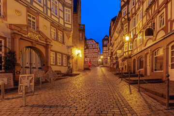 Fototapeta na wymiar Night medieval street with traditional half-timbered houses, Marburg an der Lahn, Hesse, Germany