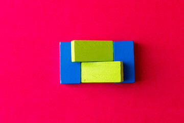 Colorful Wooden Toy Blocks On red Background