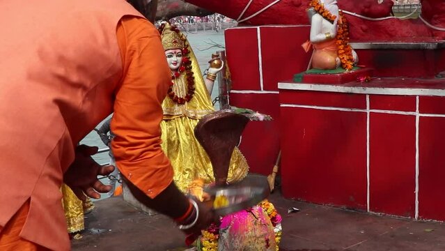 priest worshiping god in a temple