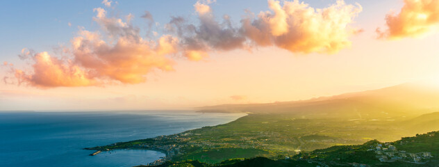 picturesque view to a sunset sea gulf with beautiful mountains and amazing cloudy sky on background of nice travel landscape