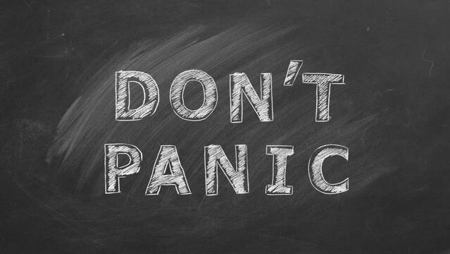Hand drawing and animated text DONT PANIC on black chalkboard.