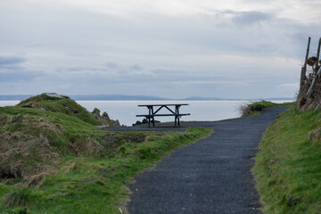 Northern Ireland Coastal Retreat: Peaceful Seaside Bench View