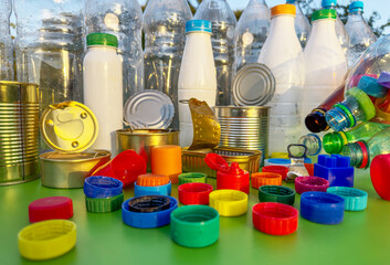 Plastic Recycling. Tin can and plastic Bottle Caps for Recycling. Steel and tin cans and Plastic...