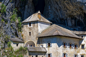 Beautiful impressive medieval castle with cave in the background at Slovenian village of Predjama...