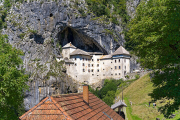 Beautiful impressive medieval castle with cave in the background at Slovenian village of Predjama...