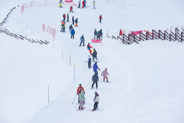 People on the ski on the winter resort.