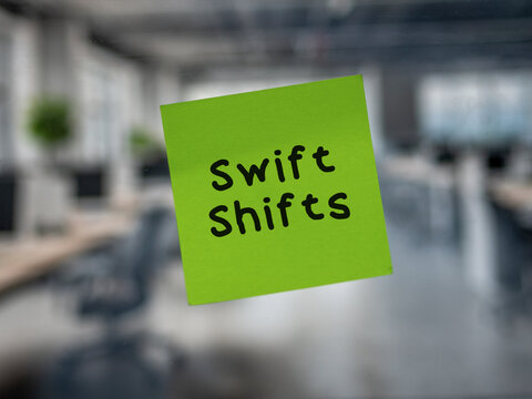 Post note on glass with 'Swift Shifts'.
