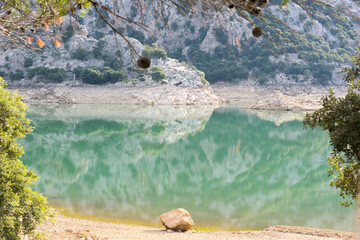 The Cuber reservoir in Majorca with turquoise water during the dry summer months - 763215493