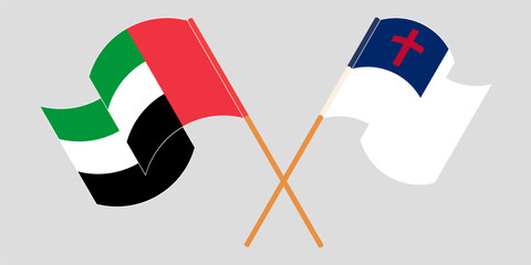Crossed and waving flags of the United Arab Emirates and christianity