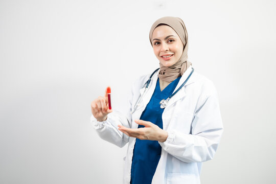 Muslim Arab person. The face of a female doctor on an isolated white background.