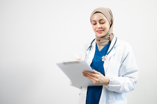 Muslim Arab person. The face of a female doctor on an isolated white background.
