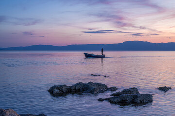 Fishing boat at sunset on the Adriatic Sea in Croatia