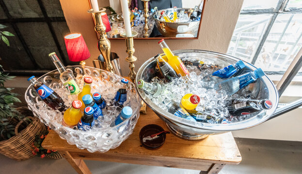 Oslo, Norway - April 27 2019: Ice chilled soda flasks at a party.
