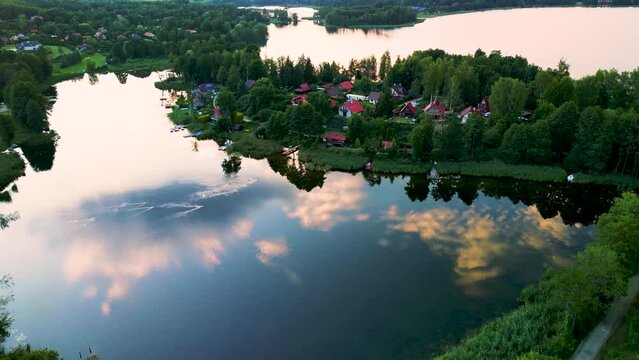Aerial view of Lake Wulpinskie and Majdy Bay at sunset, famous landmark of Warmian-Masurian Province, Poland.