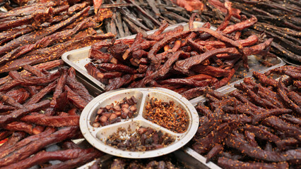 Closeup shot of the delicious Chinese food. Various dried meat on a local Chinese market. Taken...