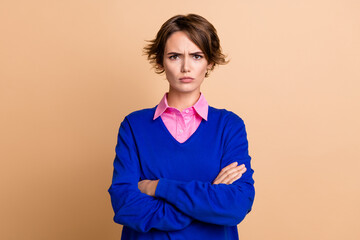Photo portrait of lovely young lady folded arms frowning annoyed wear trendy blue garment isolated...
