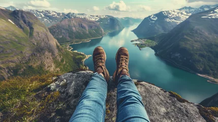 Crédence de cuisine en verre imprimé Vert bleu View from mountains lake river fjord - Hiking hiker traveler landscape adventure nature sport background panorama - Feet with hiking shoes from a woman standing resting on top of a high hill or rock