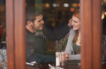 Couple, smile and holding hands on date at restaurant for bonding, romance and healthy relationship with relax. Man, woman and affection at cafe with happiness, trust and love on anniversary vacation