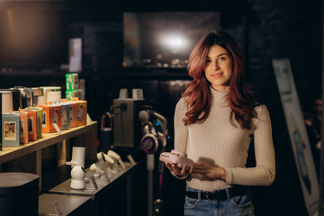 a woman chooses an instant print camera