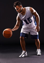 Man, playing and basketball player in studio for sports athlete for workout competition, training or black background. Male person, bounce and exercise performance or professional, fitness or mockup