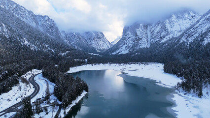 Various landscapes of Italian Dolomite region under snowfall in winter season