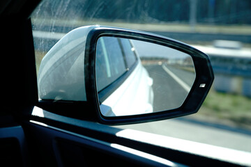 Car side mirror and defocused background