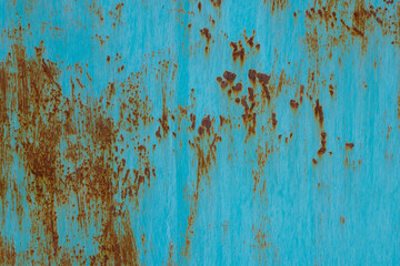 turquoise painted steel surface with stains of rust - full-frame background and texture.