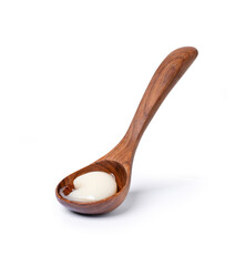 Lard in wooden spoon isolated on white background with clipping path.