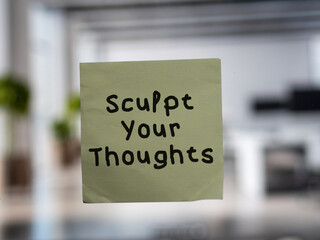 Post note on glass with 'Sculpt Your Thoughts'.