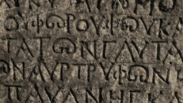 Ancient Greek writings chiseled on stone
