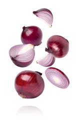 Poster Red onion with slice flying in the air isolated on white background. © NIKCOA